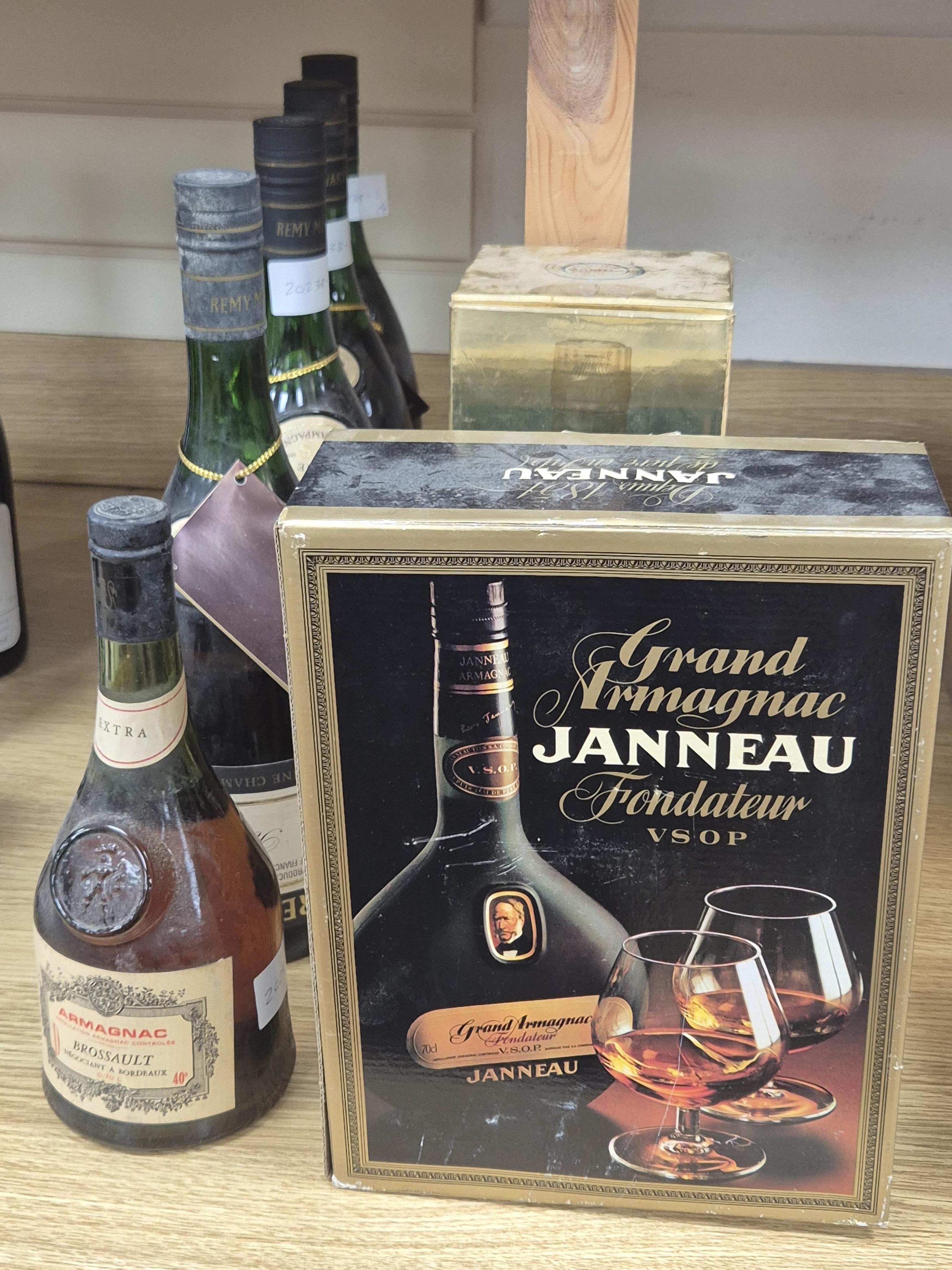 Four bottles of Remy Martin Fine VS Champagne Cognac, 48 fl.oz, 70% proof (for optics, as labels upside down), one bottle of Armagnac Brossault Extra, one boxed bottle of Camus Cognac Celebration and one boxed bottle of
